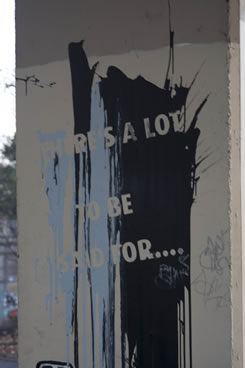 Tattered poster reading: 'There is a lot to be said for...'